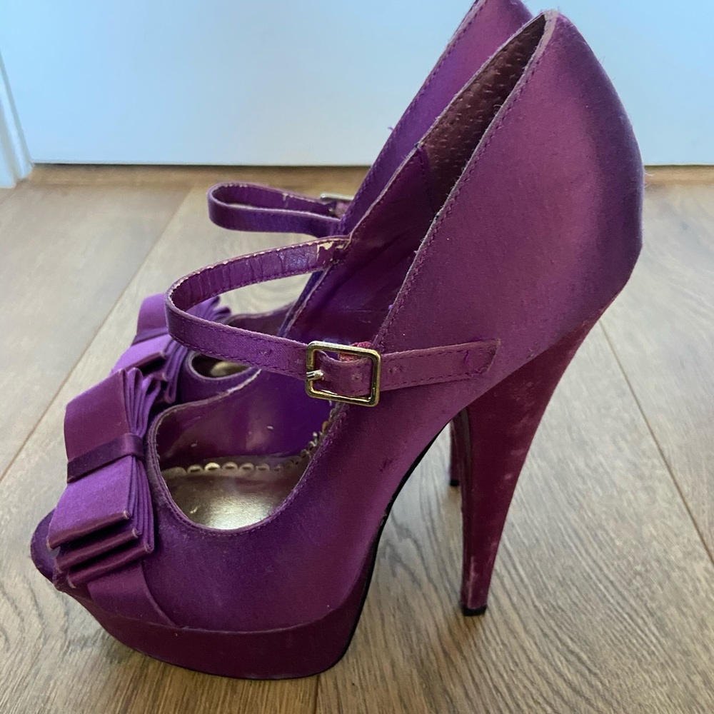 Purple platform peep toe heels with bow detail